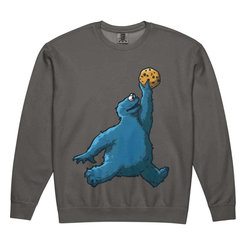 Gray sweatshirt with a blue creature holding a cookie design on a white background
