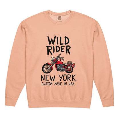 Peach-colored sweatshirt with 'Wild Rider New York' text and motorcycle graphic on a white background