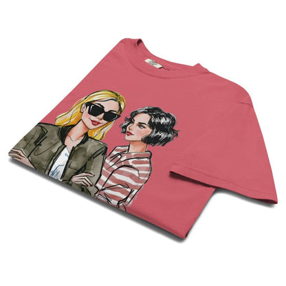Pink t-shirt with illustrations of two women on a white background