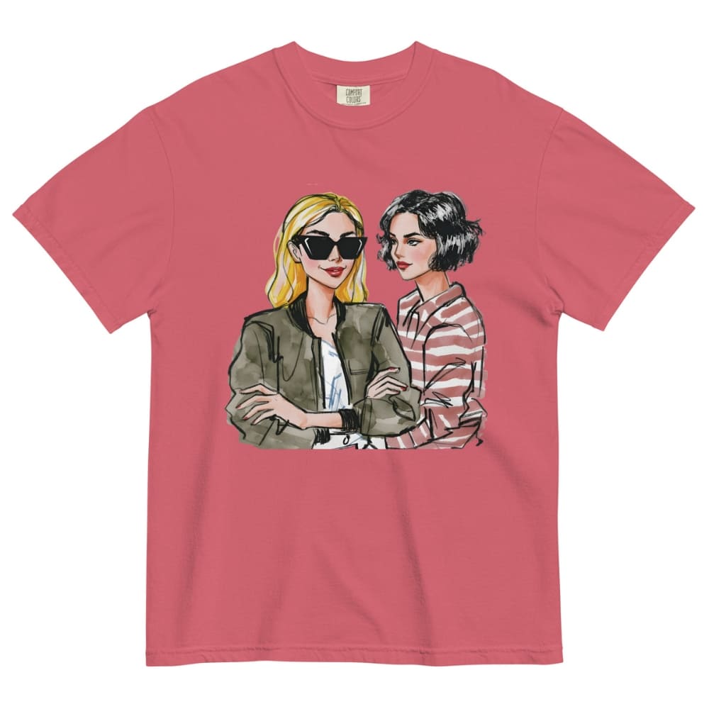 Pink t-shirt with graphic of two women on a white background