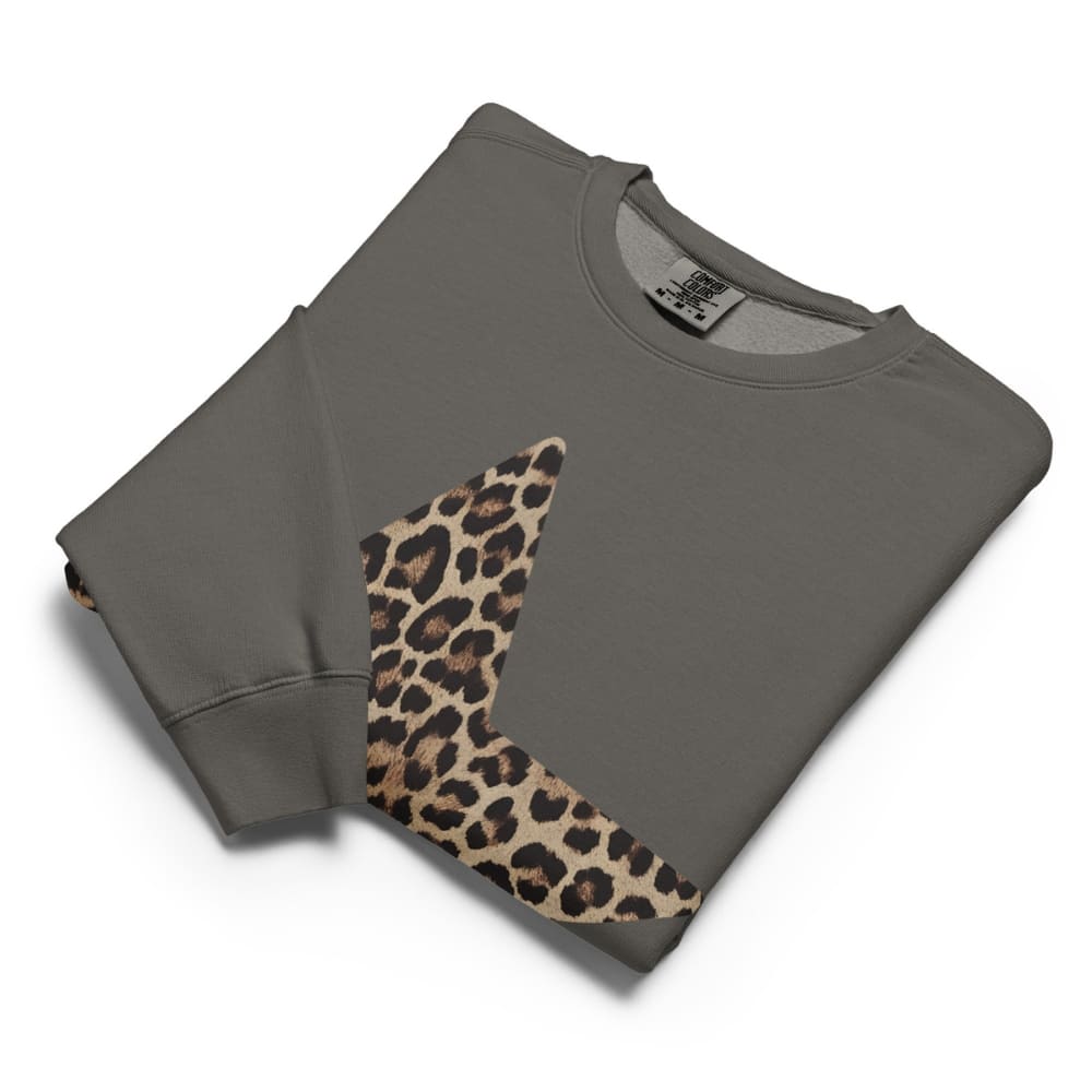 Folded gray sweatshirt with 'leopard print ' on a white background