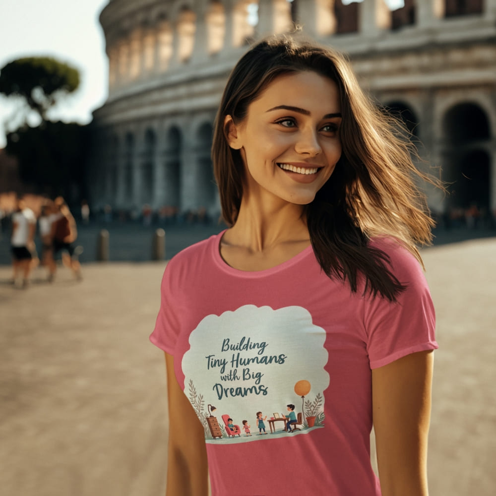 Illustrated t-shirt design with the quote "Building Tiny Humans with Big Dreams" surrounded by a family parenting scene
