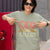 CEO of the Chaos” printed on a heavyweight cotton t-shirt in soft pastel ink, laid flat with a minimal lifestyle background.