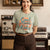 Graphic t-shirt with text “Cool Moms Raise Cool Kids” in bold vintage font – fun parenting design on soft garment-dyed cotton tee