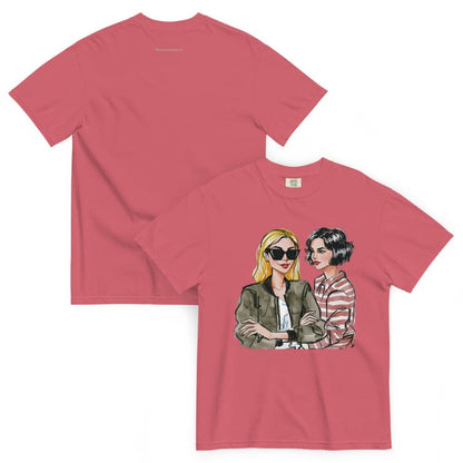 Pink t-shirt with graphic of two women on a white background
