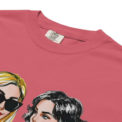Pink t-shirt with illustrations of two women's faces and 'Comfort Colors' label.