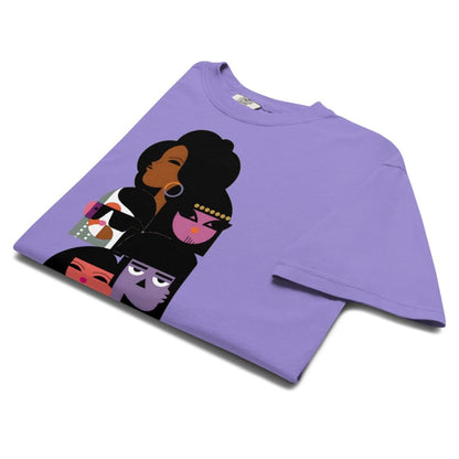 Purple t-shirt with graphic design of four stylized faces on a white background
