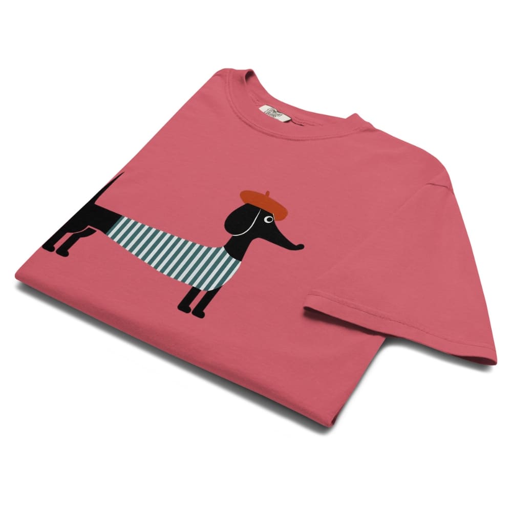 Watermelon red t-shirt with a black dog wearing a striped sweater and brown hat design on a white background