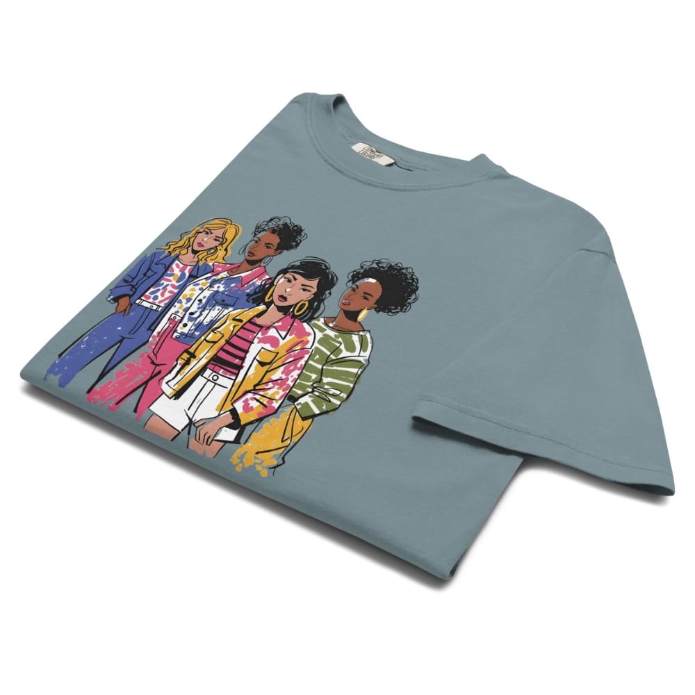 Ice-blue t-shirt with colorful graphic of four women on a white background