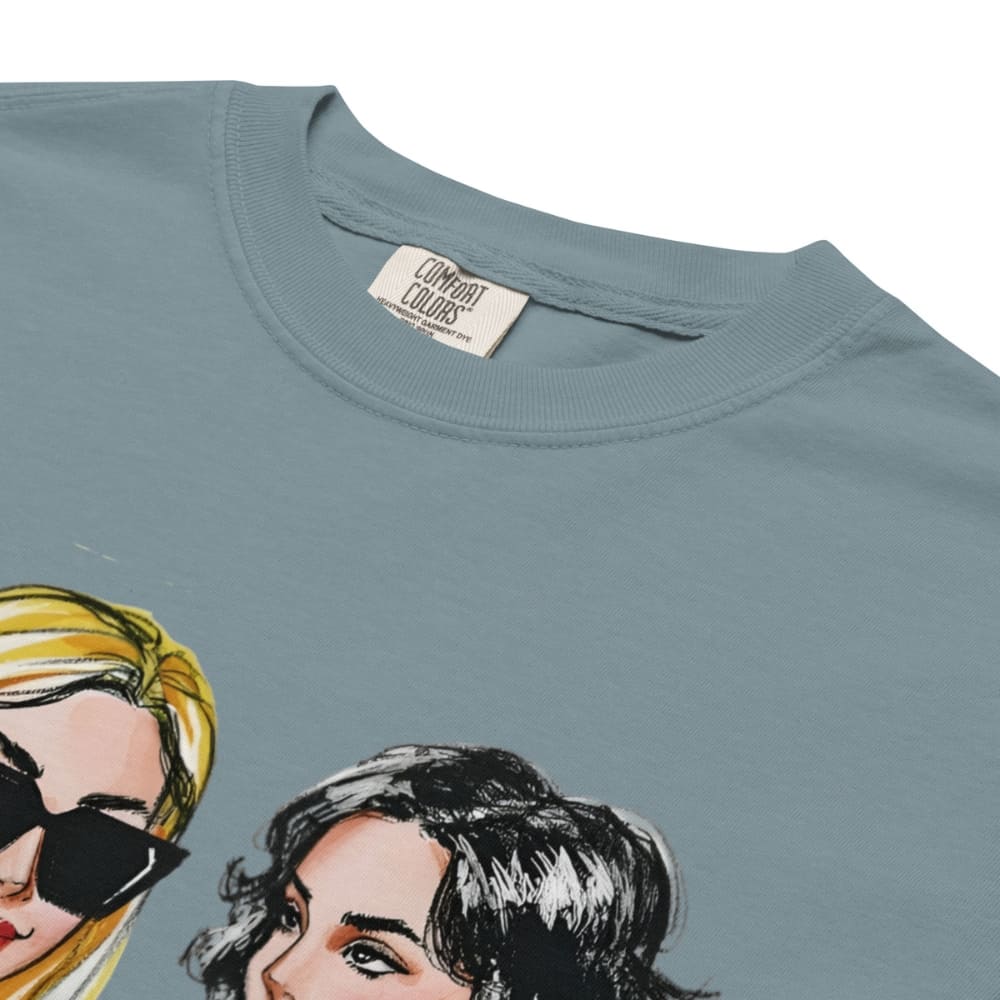 Ice-blue t-shirt with illustrations of two women's faces and 'Comfort Colors' label.