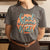 Graphic t-shirt with text “Cool Moms Raise Cool Kids” in bold vintage font – fun parenting design on soft garment-dyed cotton tee
