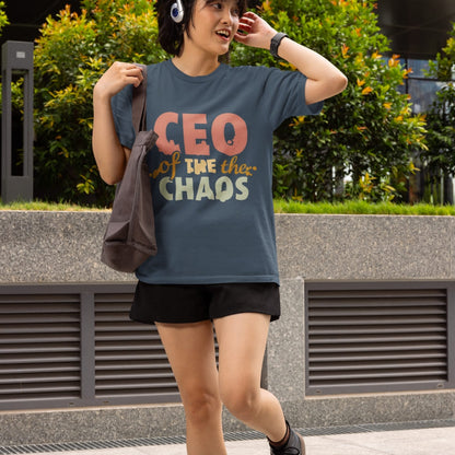 CEO of the Chaos” printed on a heavyweight cotton t-shirt in soft pastel ink, laid flat with a minimal lifestyle background.