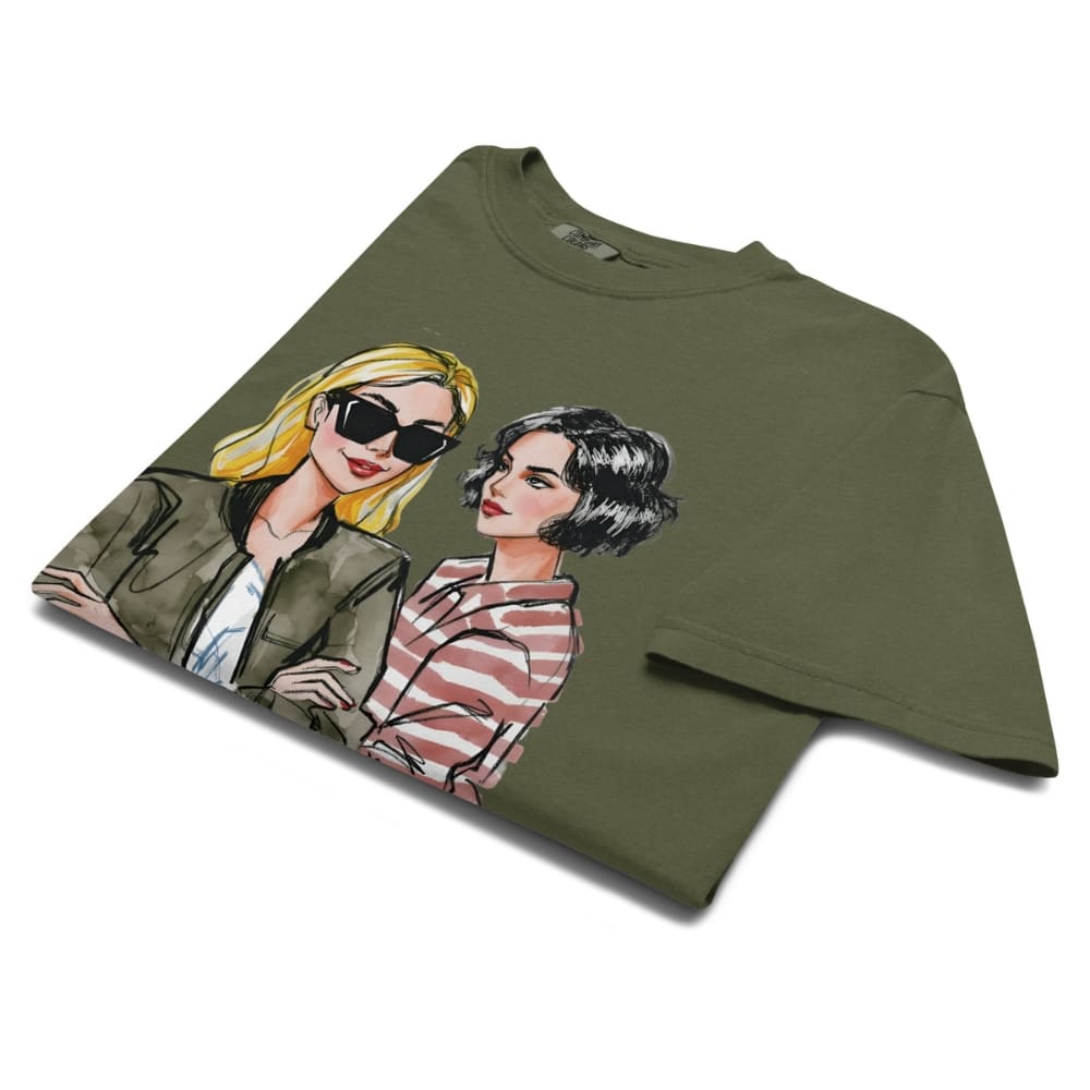 Green t-shirt with illustrations of two women on a white background
