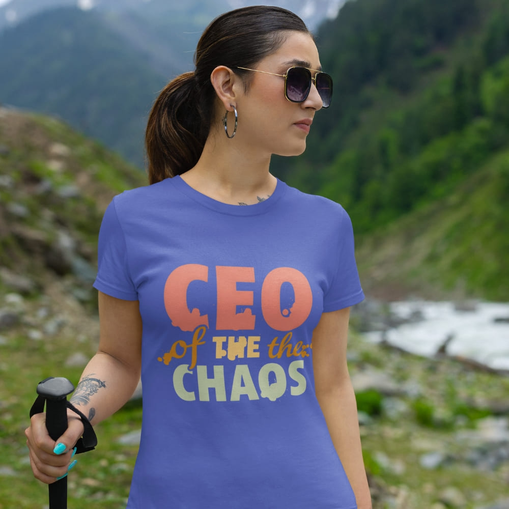 CEO of the Chaos” printed on a heavyweight cotton t-shirt in soft pastel ink, laid flat with a minimal lifestyle background.