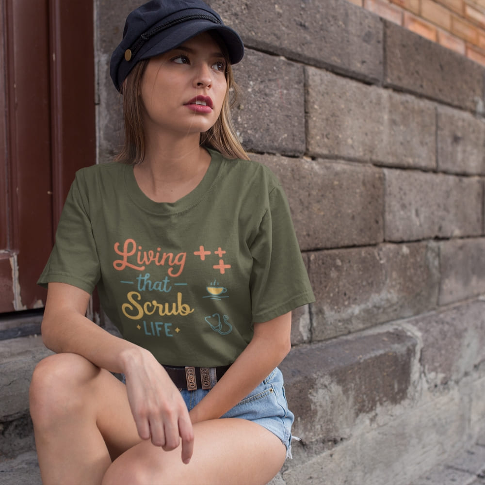 “Living That Scrub Life” colorful text printed on a garment-dyed cotton t-shirt for nurses and healthcare professionals