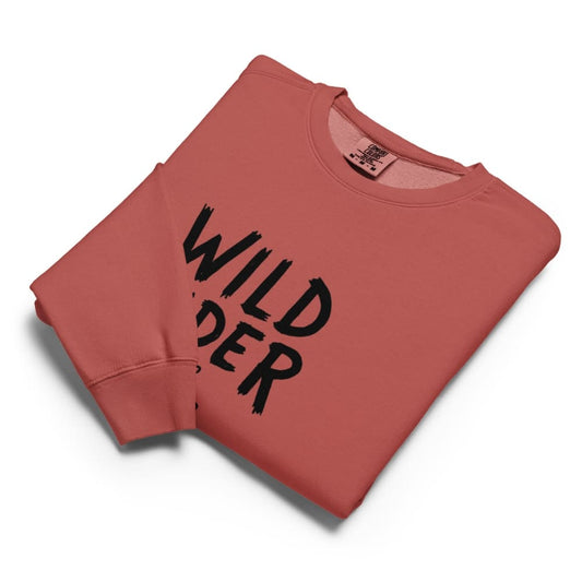 Folded red sweatshirt with 'Wild Rider' text on a white background