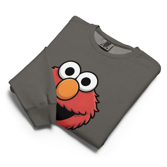 Folded gray sweatshirt with a cartoon character face on a white background