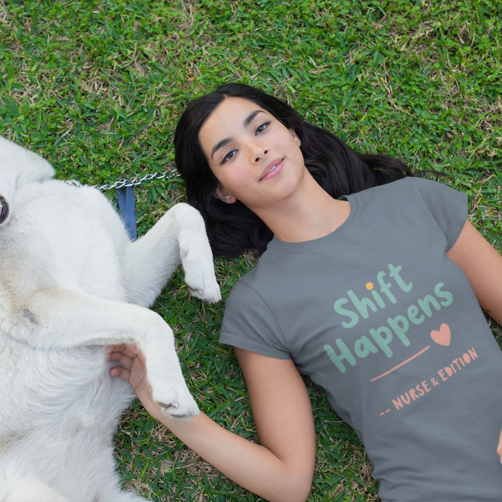 “Shift Happens – Nurse Edition” pastel text design printed on a thick garment-dyed cotton t-shirt, perfect for nurses and healthcare professionals with a sense of humor.