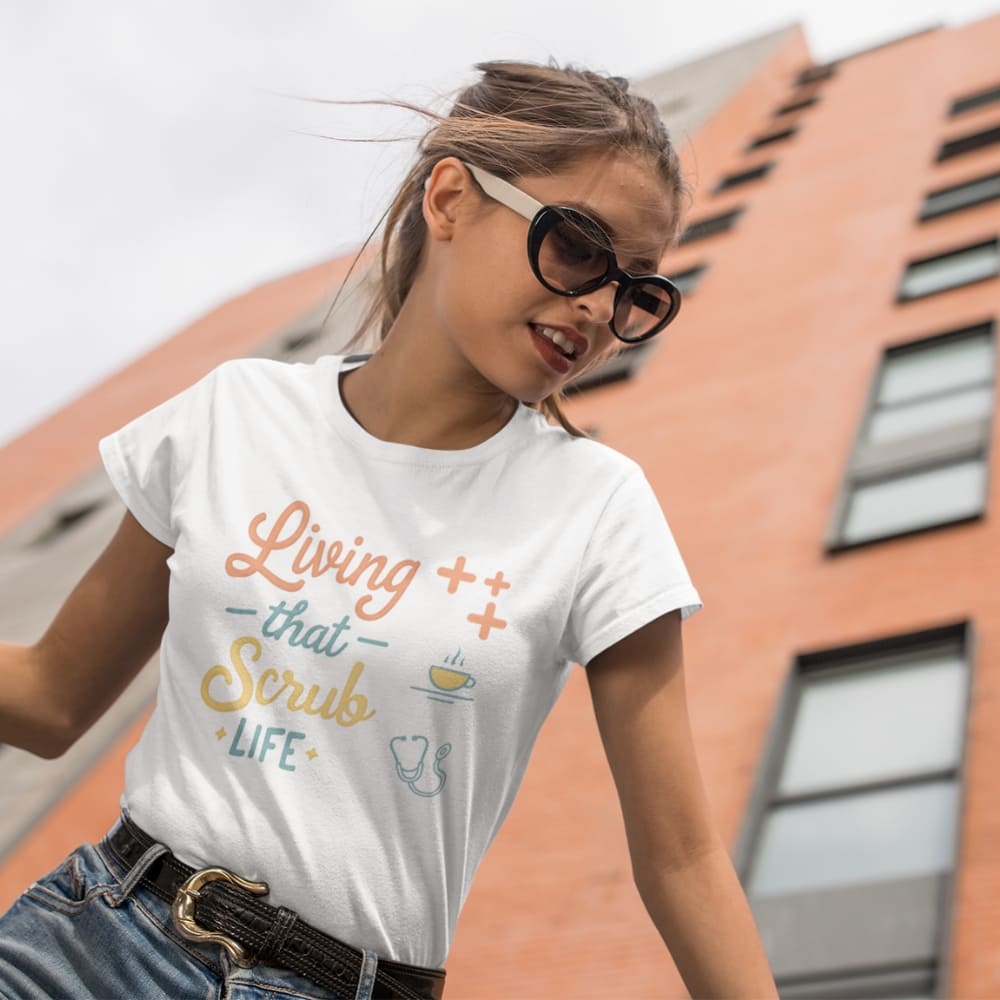 “Living That Scrub Life” colorful text printed on a garment-dyed cotton t-shirt for nurses and healthcare professionals