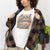 Graphic t-shirt with text “Cool Moms Raise Cool Kids” in bold vintage font – fun parenting design on soft garment-dyed cotton tee