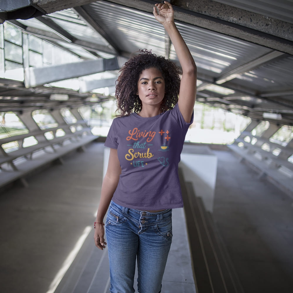 “Living That Scrub Life” colorful text printed on a garment-dyed cotton t-shirt for nurses and healthcare professionals
