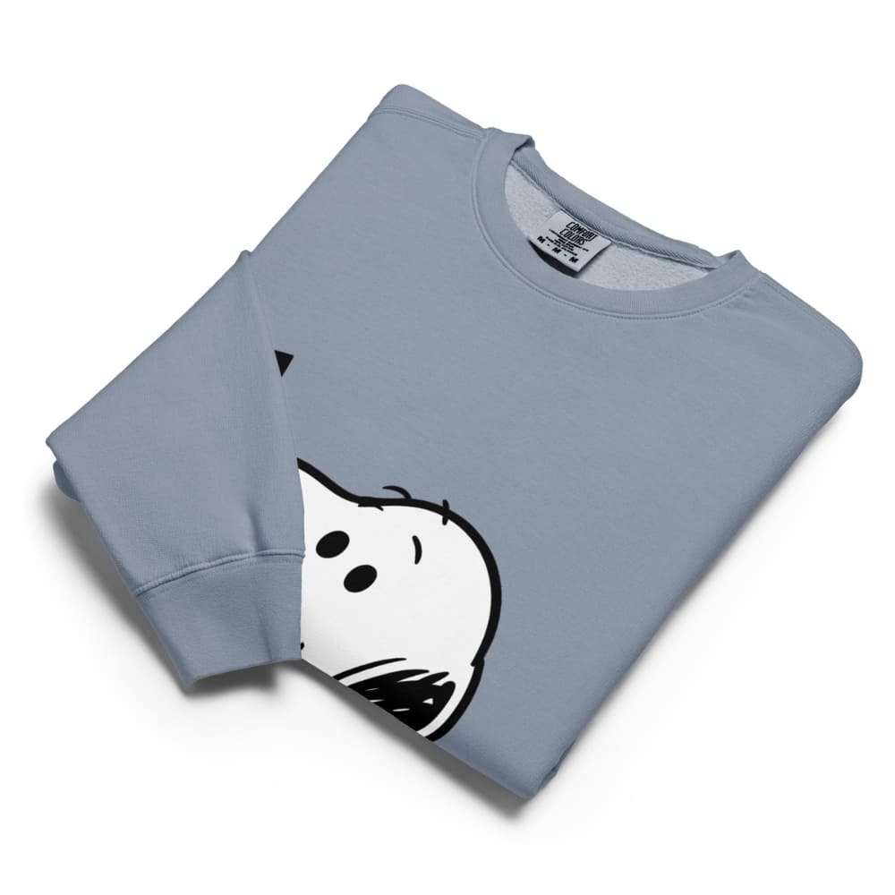 Folded light blue sweatshirt with a cartoon ghost design on a white background