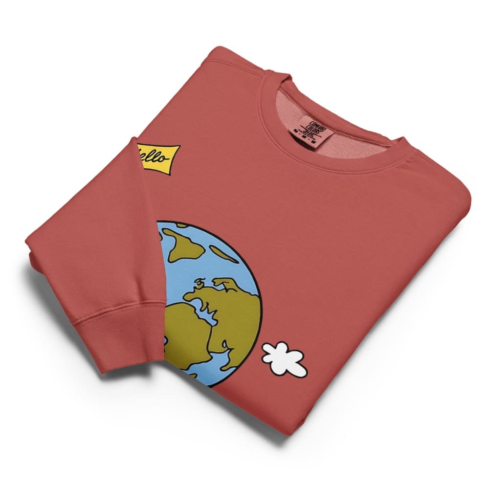Folded red sweatshirt with cartoon design on a white background